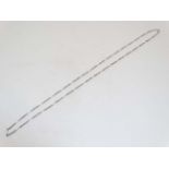 A silver and white metal longuard chain,