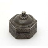 A Continental white metal pill box of hexagonal form with domed lid. Marked 800.