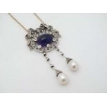 A sterling silver pendant set with amethyst cabochon, seed pears diamonds and pearl drops,