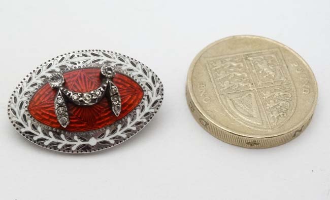 A white metal brooch of elliptical form with white and red gullioche enamel decoration and paste - Image 3 of 3