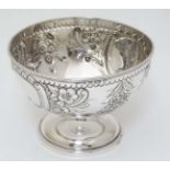 A silver small pedestal bowl with embossed decoration Hallmarked Birmingham 1902 maker J Collyer &