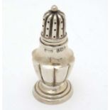 A silver pepper hallmarked Birmingham 1905 maker J.R Ltd.