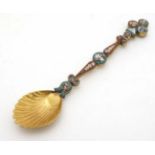 A white metal gilt decorated spoon with micro mosaic decoration handle 4 3/4" long