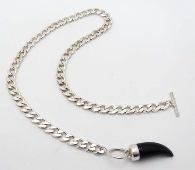 A silver flat cublink chain with black onyx like pendant. - Image 4 of 4