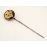 Hunting interest : An early 20thC stick pin surmounted by a ceramic cabochon depicting the head of