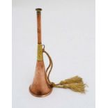 Hunting: A vintage copper and brass hunting horn with corded tassels. 10 3/4'' long.