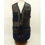 A Deerhunter Champ Deluxe Mesh back , left handed skeet vest in Navy, size M.