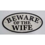 A 21st C painted cast metal oval sign "Beware of the Wife" 7" wide CONDITION: Please