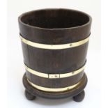 Manner of Lister a brass banded oak staved / coopered planter with circular three footed stand ,