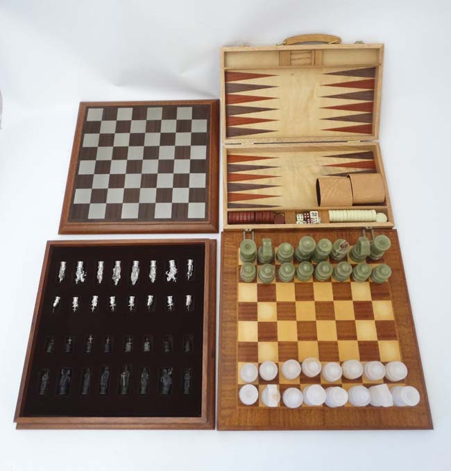 A Royal Selangor '' Camelot '' Chess set in wooden case with board to top,