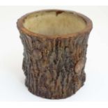 A Victorian stoneware planter pot with realistic glaze formed as a large log / cut branch and