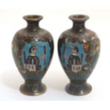 A pair of Oriental cloisonne and gilt metal small baluster shaped vases 3 1/4" high .