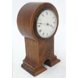 Flame Mahogany mantle clock: an unusual shaped ' Keyhole ' shaped Flame mahogany cased clock (