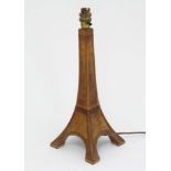 An early - mid 20thC electric wooden table lamp in the form of the Eiffel tower.