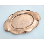 Art Nouveau : A copper tray of oval form with punch work and embossed decoration 14 1/2" long x 9