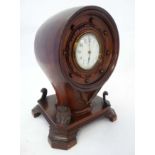 Propeller Boss Clock : a mahogany cased barrel movement clock ( timepiece ) with platform