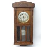 1930's Oak cased Wall Clock : an 8 day pendulum clock with pine cone logo ,