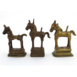 3 various brass models of horses with traces of gilt, on raised plinths.