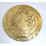 Arts and Crafts : An embossed brass firescreen formed as a charger with peacock decoration 26 1/2"