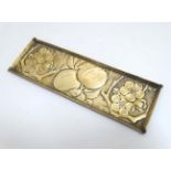 Arts and Crafts embossed brass pen tray with Aesthetic movement decoration.