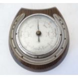 Shortland Smith : a wall mounting 20 thC oak cased aneroid barometer with applied horseshoe