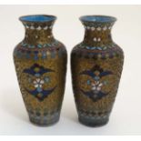 A pair of Oriental Cloisonne decorated brass baluster shaped vases standing 4 1/2" high