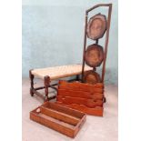 An oak double seated rush foot stool, stationary rack,