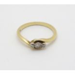 An 18ct gold ring set with trio of platinum set diamonds CONDITION: Please Note -