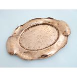 Decorative metalware - Art Nouveau : A copper tray of oval form with punch work and embossed
