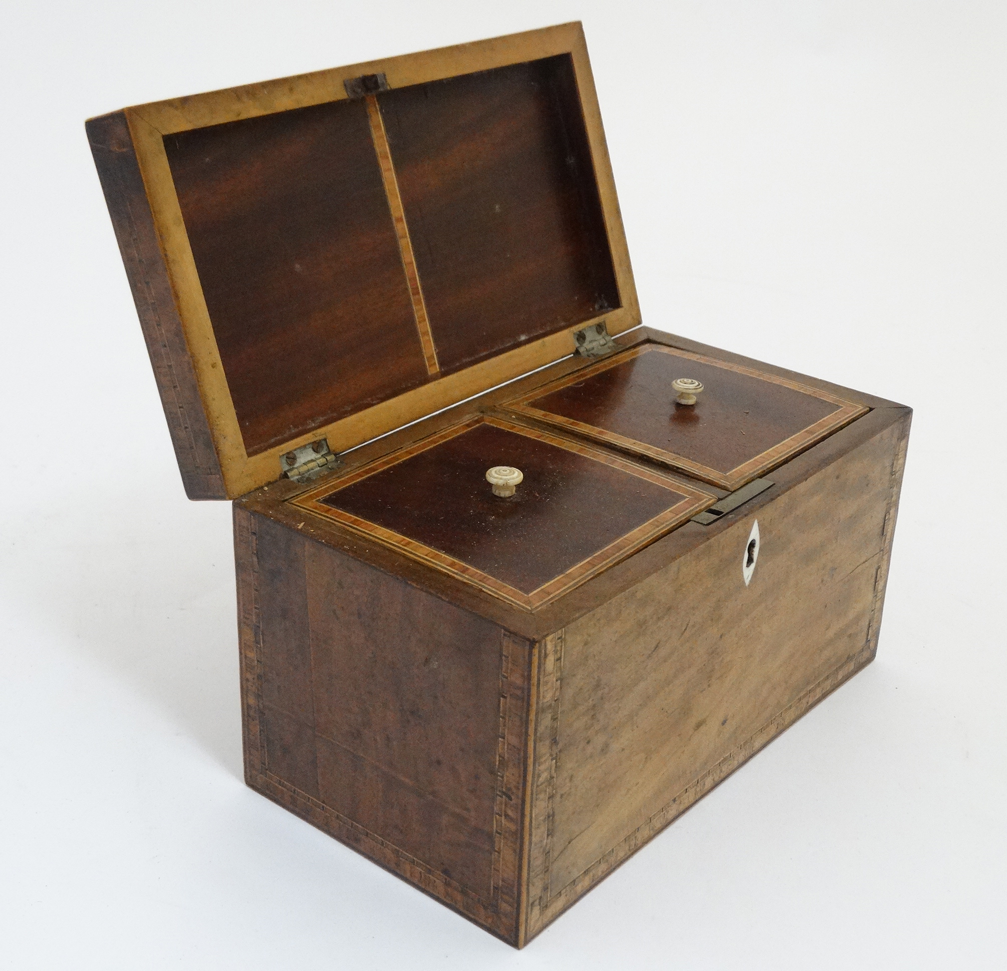 A late 18thC Sheraton shell inlaid and cross banded mahogany tea caddy opening to reveal two lidded - Image 3 of 6