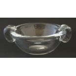 An Studio clear glass twin handled bowl.