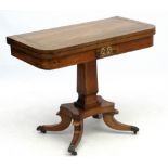 A Regency fold over pedestal card table,