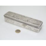 A silver box with embossed scene to lid and engraved decoration to sides,