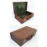 A leather travelling case with watered green silk interior and pocket to lid 21 1/2" wide