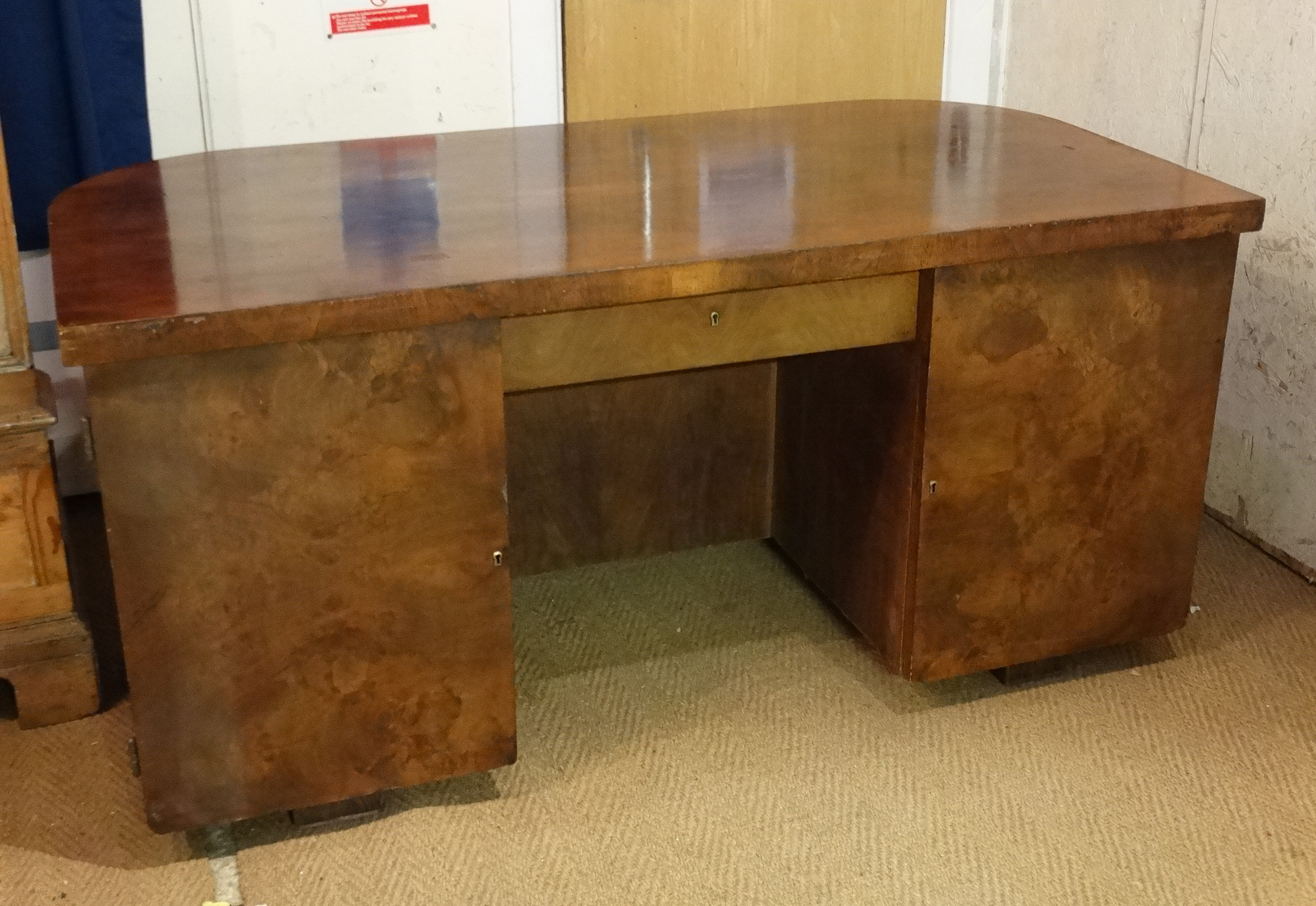 Art Deco : a Walnut office desk ( for looking into room ) , with curved front ,