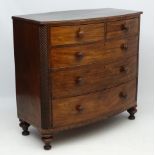 A Victorian mahogany bow fronted chest of drawers comprising 2 short drawers over 3 graduated long