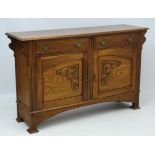 Art Nouveau : a circa 1900 oak sideboard with carved cupboard doors,