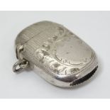 A silver plated vesta case with engraved decoration.