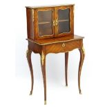 A 19thC French Bonheur du jour with ormolu and kingwood construction.