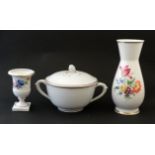 A Meissen style pot and miniature urn decorated with flowers in polychrome on a white ground with