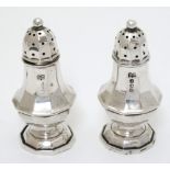 A pair of baluster formed pepperettes hallmarked London 1916 maker Robert Pringle & Sons 2 3/4"
