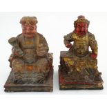 Two Chinese Immortal figures seated on squared bases,