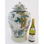 A large Chinese famille rose pot and cover,