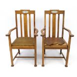 Arts and Crafts : a pair of Oak open Armchairs with canted square column legs ,