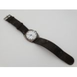 Gents Silver Watch : an early imported silver Swiss wristwatch with a circular white enamel dial