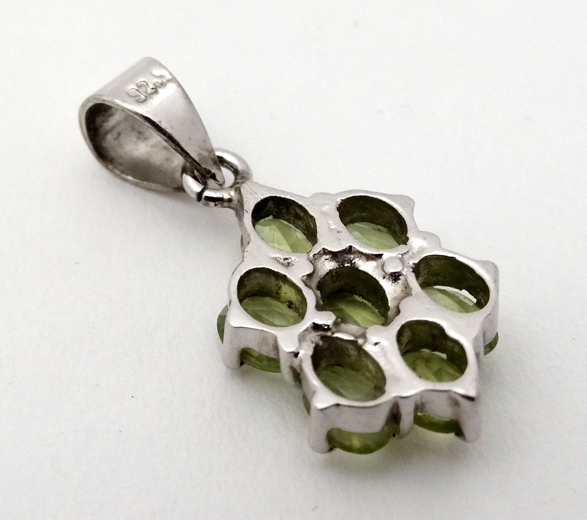 A silver pendant set with pale green stones. - Image 3 of 4