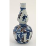 A Chinese blue and white double gourd vase with copper red ,