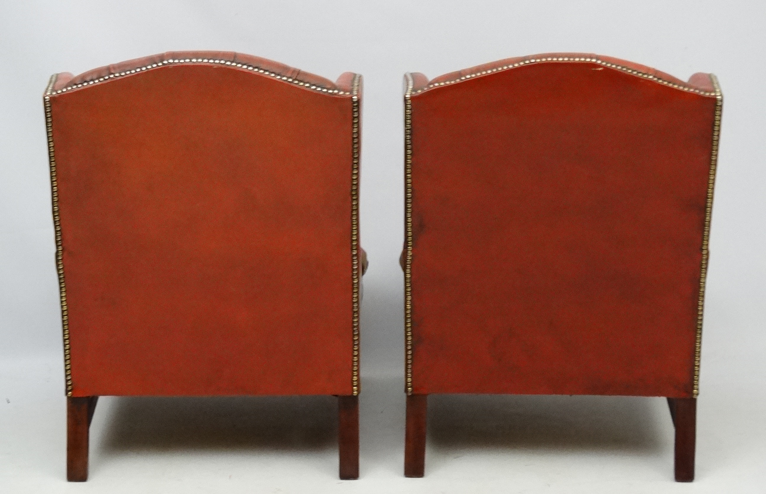 A pair of 20thC red leather wing back armchairs with button back and brass stud decoration 36 1/2" - Image 2 of 5