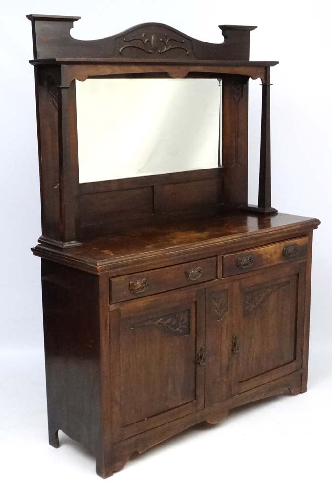 Arts & Crafts : a circa 1900 Dresser of oak , mirror back,