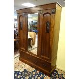 Arts and Crafts : A c.1895 wardrobe with planished copper and carved decoration.